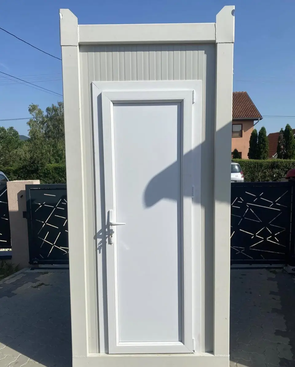 White deluxe flushing restroom unit with a full-size door
